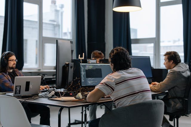 Software engineers and developers at workstations